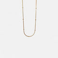 Cadena Hv Hermanas Villegas de tejido cola de ratón en cobre con baño de oro rosé y esferas brillantes minimalistas.