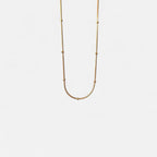 Cadena Hv Hermanas Villegas de tejido cola de ratón en cobre con baño de oro rosé y esferas brillantes minimalistas.