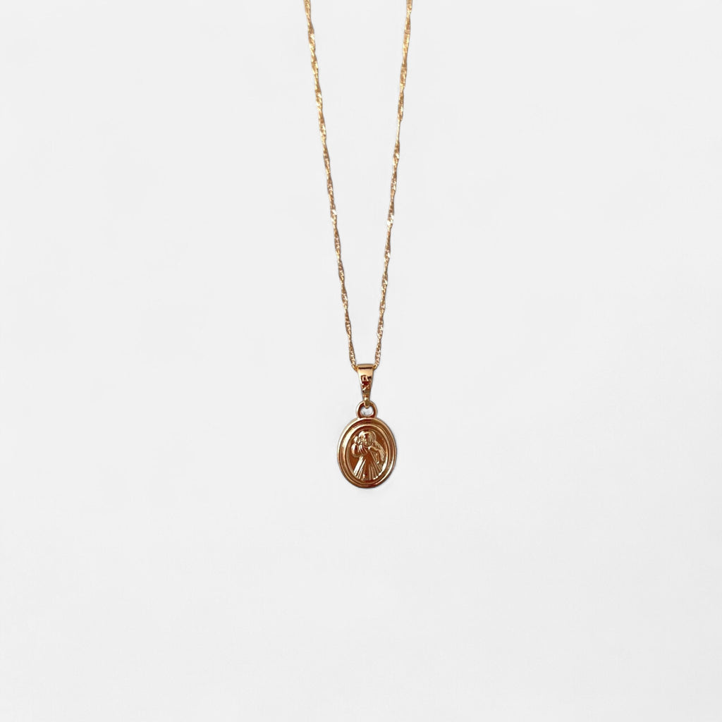 Collar Hv Hermanas Villegas con cadena entorchada y medalla ovalada del Señor de la Misericordia en oro rosé.