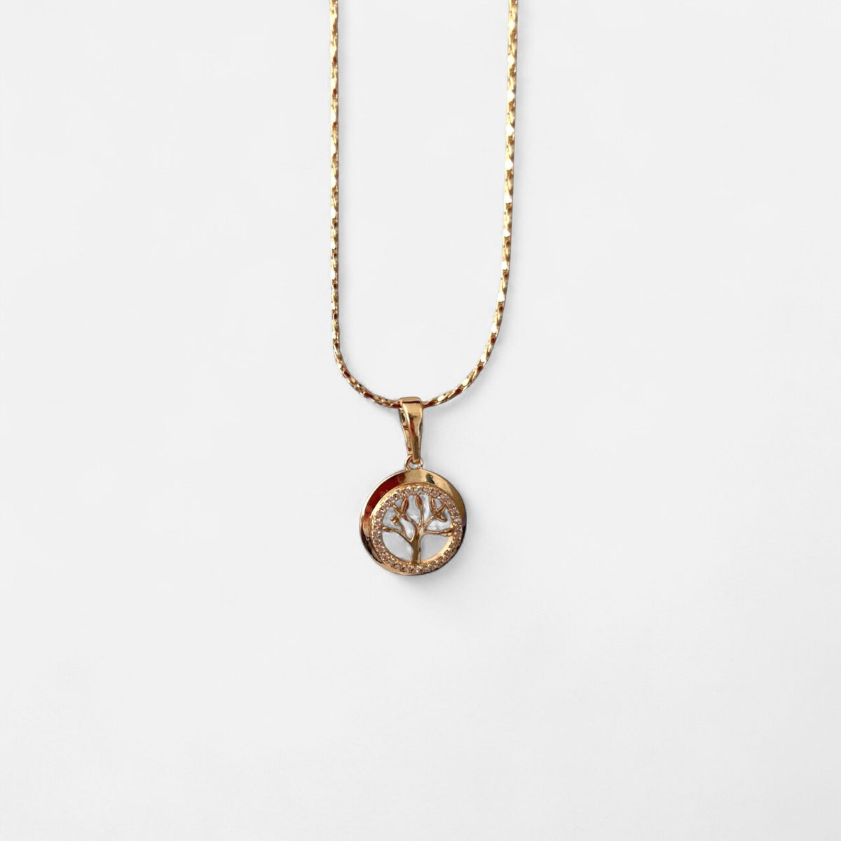 Collar Hv Hermanas Villegas con cadena entorchada y dije circular de Árbol de la Vida en oro rosé con circonias.