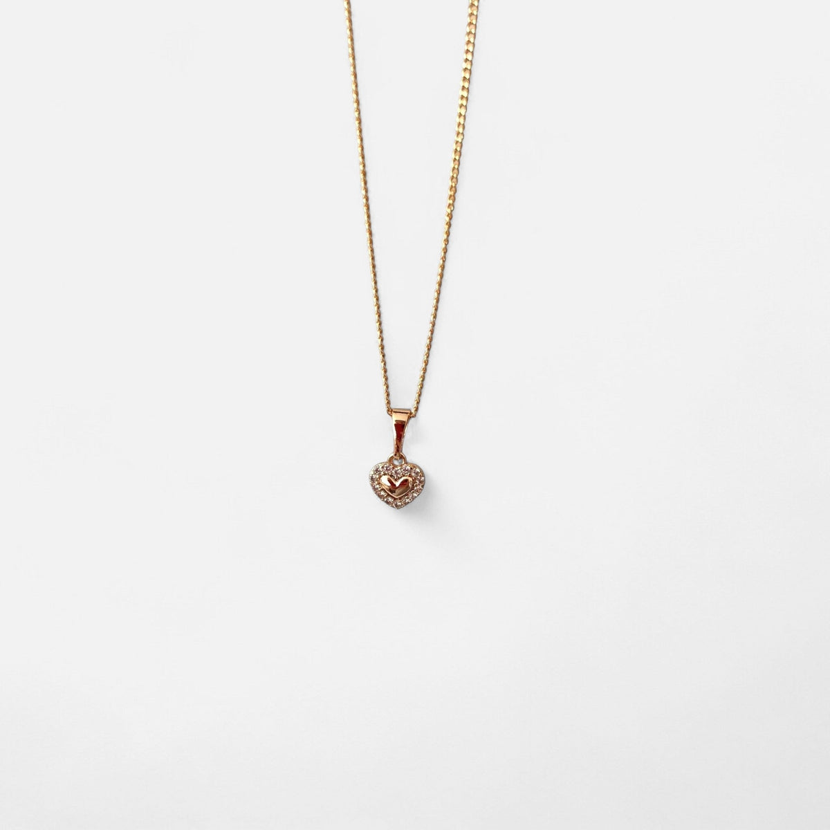 Collar Hv Hermanas Villegas de cadena grumet en oro rosé con dije de corazón y halo de circonias brillantes