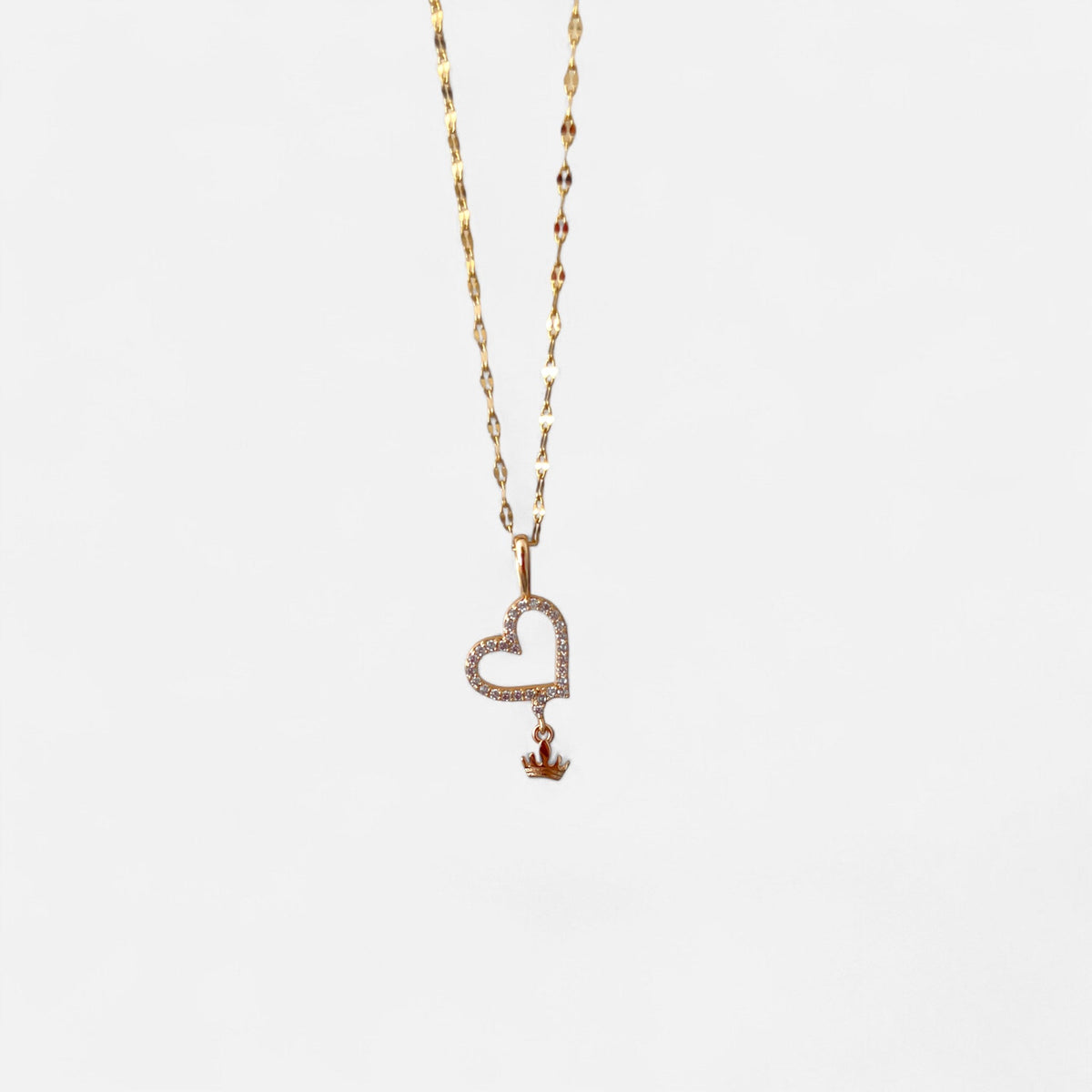 Collar Hv Hermanas Villegas de cadena espejo en oro rosé con dije de corazón pavé y corona colgante de circones
