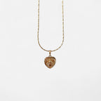 Collar Hv Hermanas Villegas con cadena entorchada y medalla de corazón reversible de la Virgen del Carmen en oro rosé