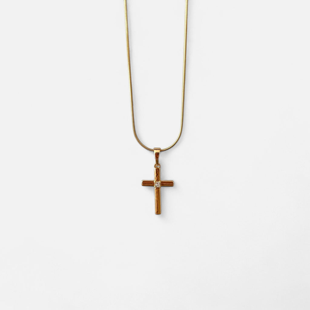 Collar Hv Hermanas Villegas de cadena cola de ratón en oro rosé con dije de cruz y circonia central brillante.