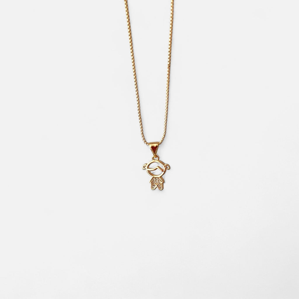 Collar Hv Hermanas Villegas con cadena veneciana y dije de niña en oro rosé con circonias brillantes.