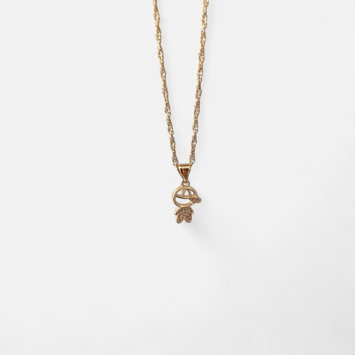Collar Hv Hermanas Villegas con cadena singapur y dije de niño con gorra y circonias en baño de oro rosé