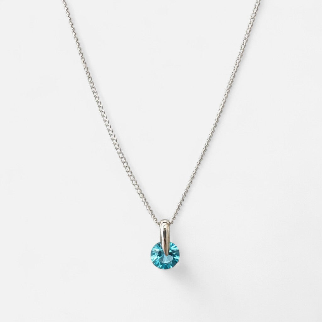 Collar Hv Hermanas Villegas de plata 925 con cadena Singapur y dije de punto de luz en cristal color azul celeste