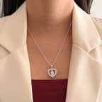 Collar Hv Hermanas Villegas de plata 925 con dije de corazón, circonitas y la Virgen de Guadalupe en el centro.