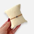 Pulsera Hv Hermanas Villegas estilo cubano en oro rosa con dije de ojo turco negro y circones