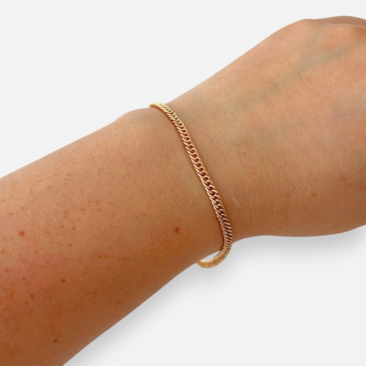 Pulsera Hv Hermanas Villegas de tejido espiga en oro rosa con eslabones entrelazados