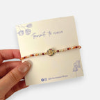 Pulsera Hv Hermanas Villegas de hilo con cuentas Murano, dije de Virgen de Guadalupe y circones multicolor en acero