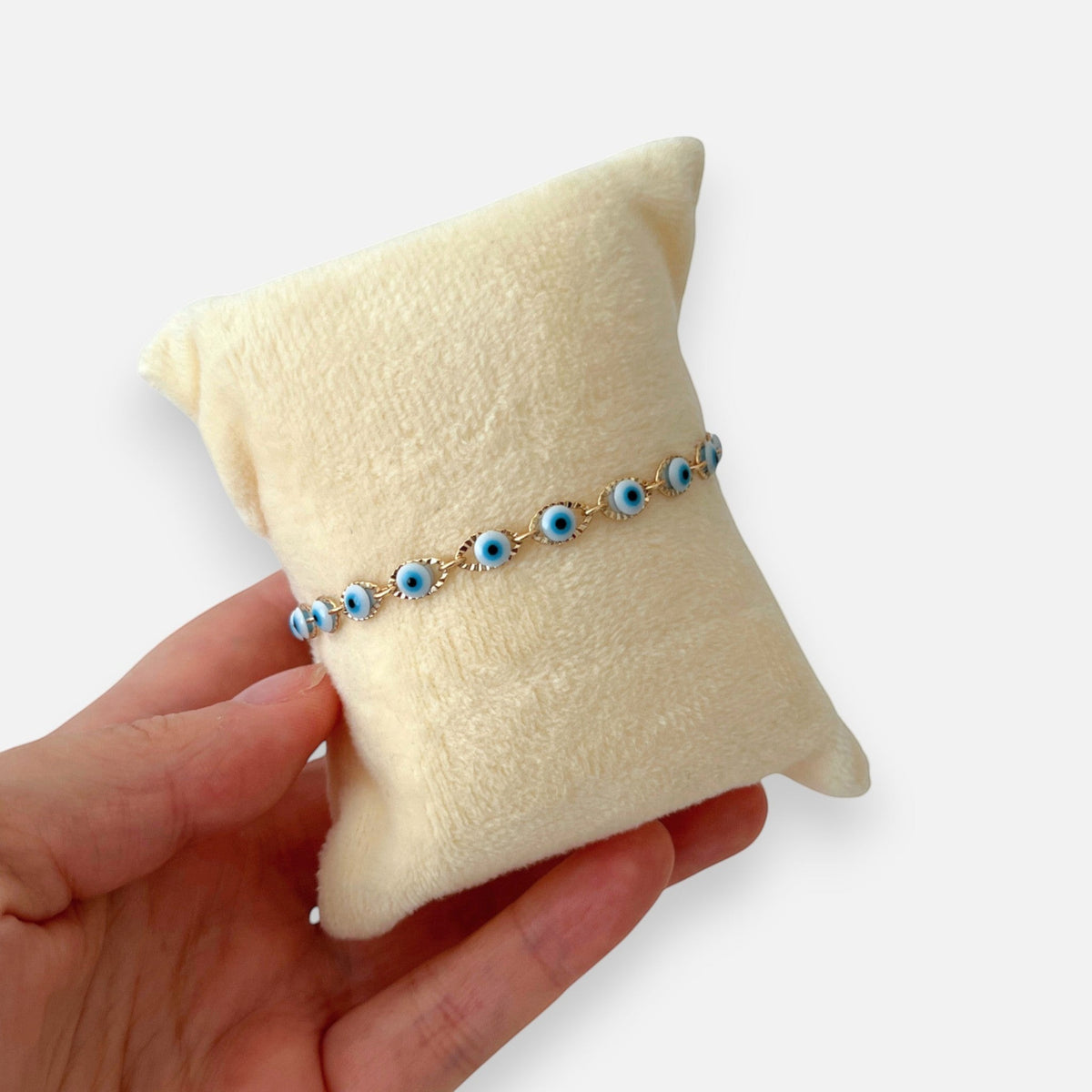 Pulsera Hv Hermanas Villegas de oro rosa con pequeños ojos turcos azules