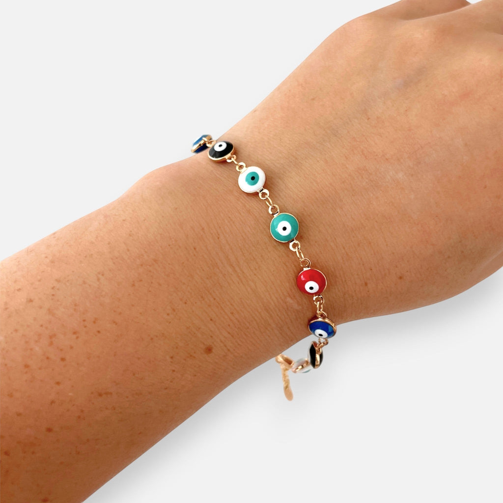 Pulsera Hv Hermanas Villegas de oro rosa con dijes de ojo turco multicolor