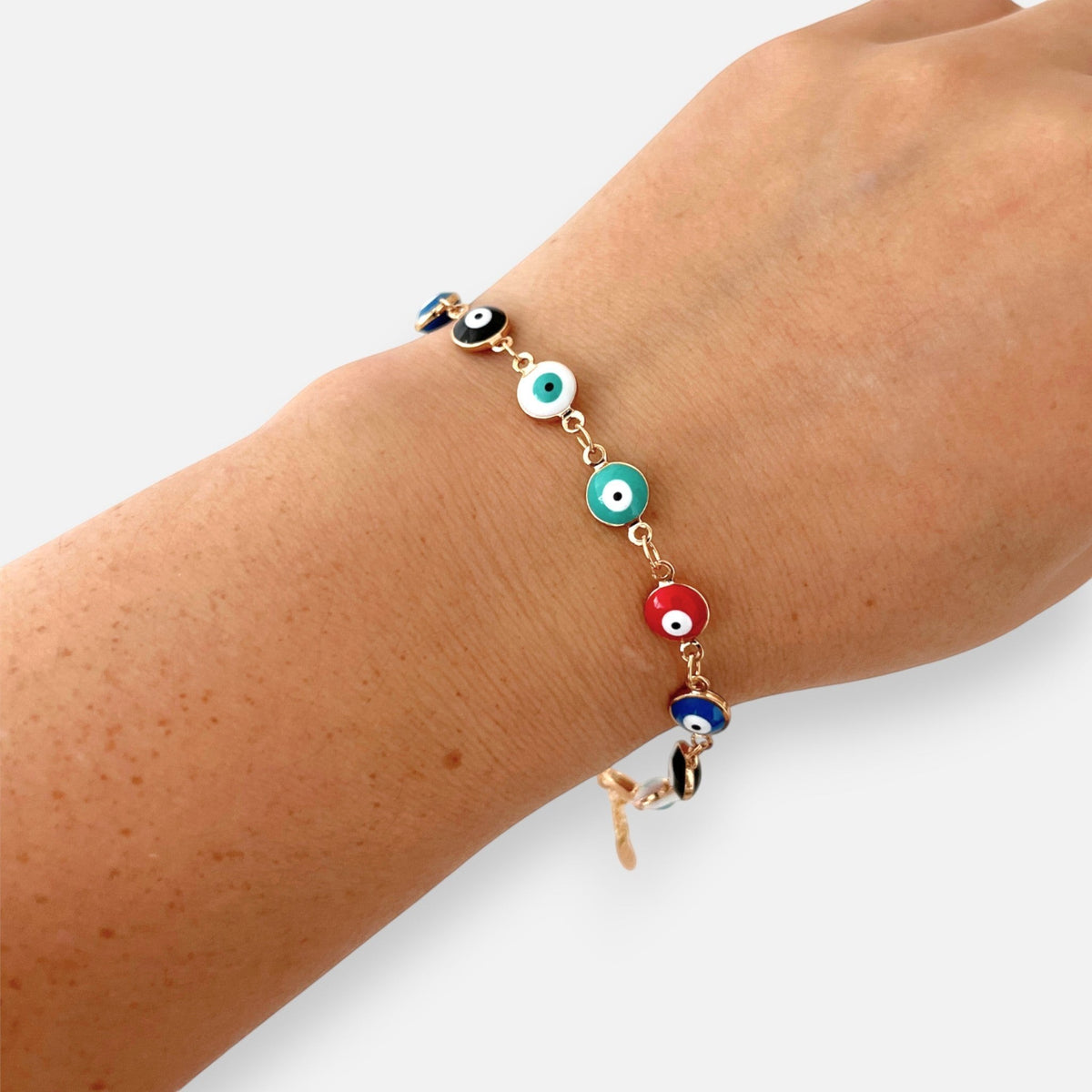 Pulsera Hv Hermanas Villegas de oro rosa con dijes de ojo turco multicolor
