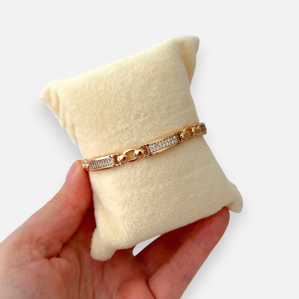 Pulsera Hv Hermanas Villegas de placas rígidas en oro rosa con incrustaciones de circones brillantes