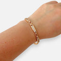 Pulsera Hv Hermanas Villegas de placas rígidas en oro rosa con incrustaciones de circones brillantes