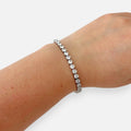 Pulsera estilo Tennis de Hv Hermanas Villegas en acero inoxidable plateado con hilera de circones brillantes