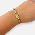 Pulsera Hv Hermanas Villegas de hilo con cuentas Murano, dije de Virgen de Guadalupe y circones multicolor en acero