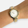 Reloj unisex Hv Hermanas Villegas bicolor en acero con dial blanco texturizado y caja redonda dorada y plateada