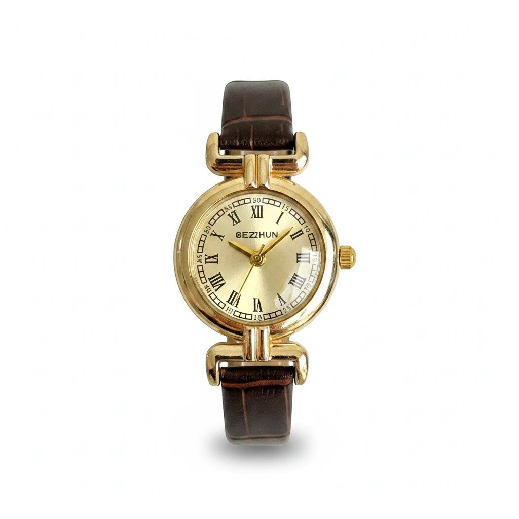 Reloj Hv Hermanas Villegas dorado con dial champán, números romanos y correa de cuero vegano marrón estilo vintage