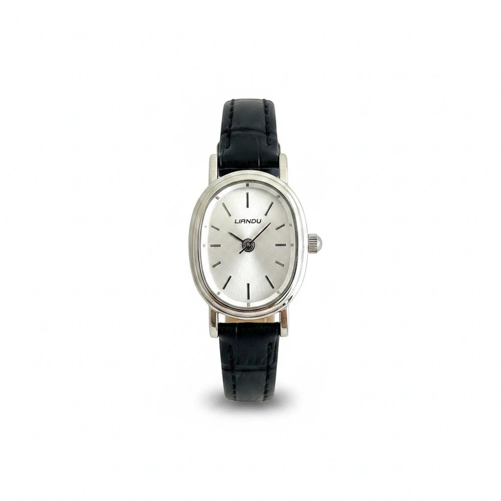 Reloj Hv Hermanas Villegas ovalado plateado con dial satinado y correa de cuero vegano negro estilo vintage