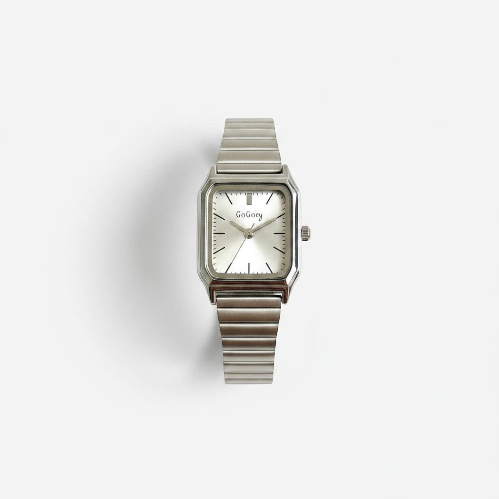 Reloj Hv Hermanas Villegas rectangular plateado con caja biselada, dial satinado y correa extensible de acero