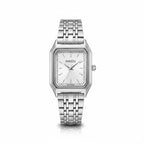 Reloj analógico Hv Hermanas Villegas con caja rectangular plateada, dial satinado y correa de acero inoxidable pulido.